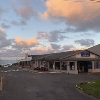 Exterior of Orcas Beach Pub & Grill at sunset